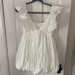 White bubble dress from Hazel and Olive. Short, V neck